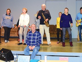 Photo by KEVIN McSHEFFREY/THE STANDARD
The Stage Door Players cast, with the director Rick Baird seated, during a recent rehearsal. They will be putting on their first show in two and a half years on May 20 at Gentle Shepherd Church.