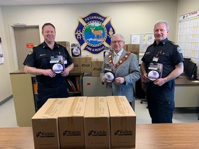 The Petawawa Fire Department received nearly 200 combination smoke and carbon monoxide alarms though the Safe Community Project Zero through a grant from Enbridge Gas. Inspecting the new units were (from left) Deputy Chief Craig Proulx, Petawawa Mayor Bob Sweet and Simon Brooks, chief fire prevention officer.