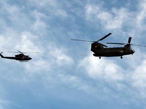 CH-146 Griffon (left) and CH-147F Chinook helicopters will be conducting training flights around Pembroke and Petawawa until April 14. The helicopters are seen here during a flyover near the Pembroke Regional Hospital in May 2020 as a thank you to front-line workers during the COVID-19 pandemic.