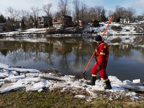 Volunteer firefighter Greg St. Clair walks the banks of the Thames River in St. Marys Thursday, five days into the search for a missing 10-year-old girl who feel through ice on Whirl Creek in Mitchell. CHRIS MONTANINI/POSTMEDIA NETWORK