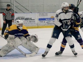 Woodstock's Jonah Jacksteit battles for position in front of New Hamburg goalie Griffin Murphy during Game 4 of the PJHL Doherty Division semifinal Monday in New Hamburg.