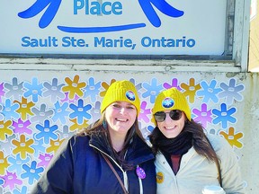 Shauna and Mackenzie take a break at this year's CNOY fundraiser. SARA McCLEARY