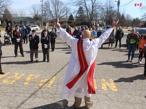 Deacon Rudy Terpstra, padre of Branch 216 of the Royal Canadian Legion in Petrolia, speaks during a vigil for Ukraine held Sunday the parking lot of the legion hall.