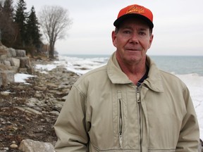 Cary Clifford is pictured along the Old Lakeshore Road right-of-way behind his Passingham Drive property.  The resident there since 1998 said people have already been walking there for decades, and he doesn't mind the council's recent decision to investigate creating a public-access pathway.  (Tyler Kula/The Observer)