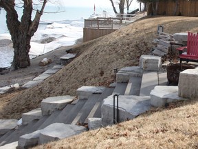 Tom Strifler said he estimates the Old Lakeshore Road right-of-way starts at around the top step of the staircase leading down to Lake Huron from his Passingham Drive property.  (Tyler Kula/The Observer)