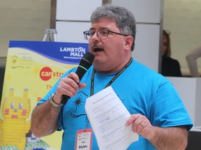 Myles Vanni, executive director of the Inn of the Good Shepherd, announces winners following judging at this year's Canstruction event Sunday at Lambton Mall in Sarnia.