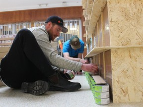 Golan Amit helps assemble an entry Saturday during Canstruction at Sarnia's Lambton Mall for a team from Carpenters Local 1256.