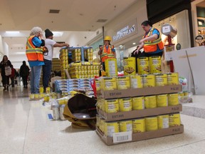 A team from Remax assembles an entry Saturday for Canstruction at Lambton Mall in Sarnia.