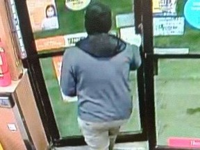 Norfolk OPP have released photos of a suspect wanted in connection to an armed robbery Saturday morning at a convenience store on James Street in Delhi.  NORFOLK OPP PHOTO