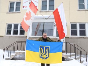 George Aniol, president of the Polish Combatant's Association Branch 24 Sudbury, shows a Ukrainian flag that is being displayed alongside with the Canadian and Polish flags at the association's hall at 291 Albinson Street in Sudbury, Ont. on Tuesday March 1, 2022. Polish Combatant's Association members want to show their solidarity with Ukraine and the local Ukrainian population. John Lappa/Sudbury Star/Postmedia Network