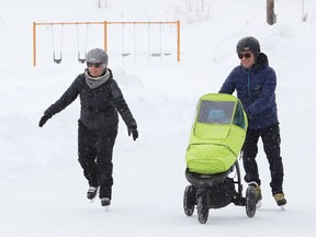 Carrie Graham and Sean Grant go for a skate with there son Fred, at Queen's Athletic Field skating oval in Sudbury, Ont. on Wednesday March 2, 2022. John Lappa/Sudbury Star/Postmedia Network
