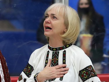 A choir member from the Ukrainian National Federation is overcome with emotion while singing the Ukrainian national anthem prior to the start of the Sudbury Wolves game against the Kingston Frontenacs at the Sudbury Community Arena in Sudbury, Ont. on Friday March 4, 2022. The local Ukrainian community wanted to show their support for Ukraine with the hope of peace. John Lappa/Sudbury Star/Postmedia Network