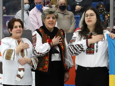 Choir members from the Ukrainian National Federation sing the Ukrainian national anthem prior to the start of the Sudbury Wolves game against the Kingston Frontenacs at the Sudbury Community Arena in Sudbury, Ont. on Friday March 4, 2022. The local Ukrainian community wanted to show their support for Ukraine with the hope of peace. John Lappa/Sudbury Star/Postmedia Network