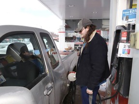 Louie LeRiche prepares to fill his vehicle with gas on Tuesday March 8, 2022. The price of gas has skyrocketed to nearly $2 per litre at some gas stations in Greater Sudbury, Ont. John Lappa/Sudbury Star/Postmedia Network