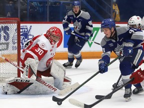 Evan Konyen, right, of the Sudbury Wolves, attempts to fire the puck past goalie Tucker Tynan, of the Soo Greyhounds, during OHL action at the Sudbury Community Arena in Sudbury, Ont. on Wednesday March 9, 2022. The Wolves lost 6-2. Read Ben Leeson's story about the game at www.thesudburystar.com. John Lappa/Sudbury Star/Postmedia Network