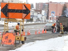 A work crew from Bruce Tait Construction Ltd. repairs a section of road on Notre Dame Avenue in Sudbury, Ont. on Friday March 11, 2022. John Lappa/Sudbury Star/Postmedia Network