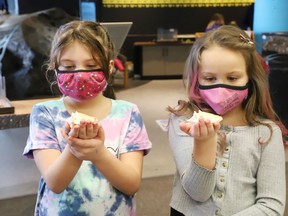 Ayriana McCoshen, 7, left, and Ava Dunphy, 7, visit the Nature Exchange at Science North in Sudbury, Ont. on Tuesday March 15, 2022. John Lappa/Sudbury Star/Postmedia Network