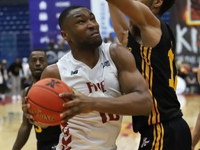 Zena Edosomwan, of the Sudbury Five, goes up for a shot during basketball action against the London Lightning at the Sudbury Community Arena in Sudbury, Ont. on Thursday March 17, 2022. John Lappa/Sudbury Star/Postmedia Network