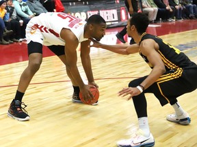 Sudbury Five's Zena Edosomwan, left, is watched closely by London Lightning's Mareik Isom during a basketball game at the Sudbury Community Arena in Sudbury, Ont. Thursday, March 17, 2022. John Lappa/Sudbury Star/Postmedia Network