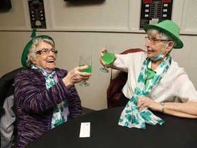 Gwen Charette, left, and Alvina Haley take part in a St. Patrick's Day celebration At Branch 564 of the Royal Canadian Legion in Sudbury, Ont. on Thursday March 17, 2022. John Lappa/Sudbury Star/Postmedia Network