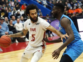 Jeremy Harris, left, of the Sudbury Five, attempts to drive past Kobi Nwandu, of the Syracuse Stallions, during basketball action at the Sudbury Community Arena in Sudbury, Ont. on Friday March 18, 2022. John Lappa/Sudbury Star/Postmedia Network