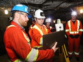 Francis Nepveu, left, of NSS Canada, instructs Zach Dube, of College Boreal's Civil and Mining Construction Engineering Technician program, at Dynamic Earth in Sudbury, Ont. on Tuesday March 22, 2022. The students were learning the latest mining surveying techniques thanks to Project MOSS, which is a partnership between College Boreal, CEWIL Canada, NSS Canada and Dynamic Earth. Nepveu is a former student from the college program. John Lappa/Sudbury Star/Postmedia Network