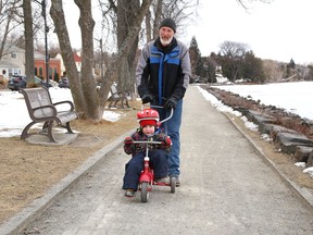 Mike Blomme and his grandson, Elijah, 3, went outside for some exercise on a cold day in Sudbury, Ont. on Wednesday March 30, 2022. Environment Canada said Greater Sudbury can expect rain showers and then showers mixed with a few flurries late in the afternoon on Thursday. The high is expected to reach 6 C. John Lappa/Sudbury Star/Postmedia Network