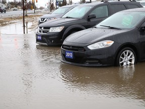 The warmer rainy weather caused a car lot to partially flood in Sudbury, Ont. on Thursday March 31, 2022.