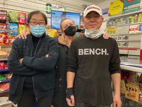 Kelly Lake Convenience owners Eunsook Park, left, and Woonsoo Kim, right, along with customer Susan Lynch, centre, together fought off a knife-wielding robber last month and held him down until police arrived.