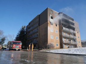Firefighters continued to spray water on a fourth-floor unit at 195 Lisgar Avenue Tuesday morning one hour after arrival.  Two minor injuries were reported in the apartment fire.  (Chris Abbott/Norfolk and Tillsonburg News)
