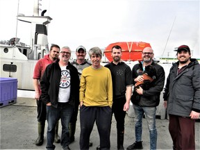 The crew and owners of Lady Anna II. From left: Craig Adamson of Leamington; John Peralta of Kingsville and co-owner of Lady Anna II; James Martin of Wheatley; Captain Mike Mummery of Wheatley; Josh Mummery of Wheatley and son of Captain Mummery; Tory Caradonna, co-owner of Lady Anna II; fleet mascot Captain Buddy; and Curtis Mummery of Wheatley and son of Captain Mummery. John Martinello photo