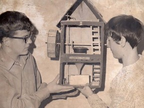 Larry and friend Brad with their 'amazing'  grist mill, Grade 8, 1971. Building materials included cardboard, Balsa wood, string, and a hockey puck.