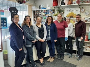 The current staff of West Elgin Pharmacy in West Lorne are Lindsay, Renee, Kelsey, Anna, Peggy, Sue, and Peter Adams. Absent from the photo are Denise, Katie, Alice and Madison.