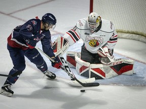 Windsor’s Daniel D’Amico misses on a scoring opportunity against Owen Sound goalie, Nick Chenard, in OHL action between the Windsor Spitfires and the Owen Sound Attack at the WFCU Centre, on Thursday, March 10, 2022.  (DAX MELMER/Windsor Star)