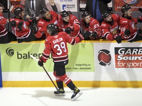 The Owen Sound Attack celebrate after Colby Barlow's third-period goal as the Attack host the Kitchener Rangers inside the Harry Lumley Bayshore Community Centre in Owen Sound on Wednesday,March 2, 2022. Greg Cowan/The Sun Times