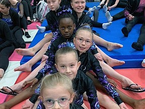 Precision Gymnastics gymnasts (Front to Back) Raina Johnston, Lacey Adloff, Avery Walker, Alexa, Schmidt, Brooklynn Church, Abigayle Ryshcka and Aubree Gauvin recently competed in the Salto Gymnastics Challenge at the Expo Centre in Edmonton.