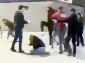 Shawn Melo on the ground in Whitby as a group of individuals kick him. Melo, the father of a Kingston Canadians player, has been charged by Durham Regional Police with shoving a Whitby player. The alleged incident then spilled out into the parking lot where video shows Melo being assaulted. (Video provided by Shawn Melo)