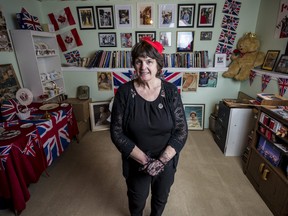 Ronda Moran, a monarchy enthusiast from Brighton, stands amidst her collection of items related to the Royal Family of England in the basement of her home. March 31 in Brighton, Ontario. ALEX FILIPE