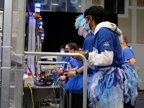 Drivers for the blue alliance in the final of the FIRST competition in North Bay - teams 4152, 1305 and 8729 - guide their robots to a second-place finish, Sunday.
PJ Wilson/The Nugget