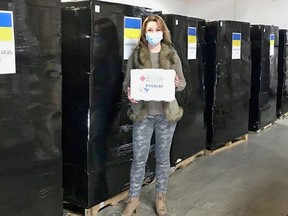 Lesya Chapman with one of the first-aid kits that are being sent to Ukraine.