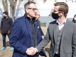 Kenora-Rainy River MPP Greg Rickford and KDSB CAO Henry Wall congratulated each other on a job well done at the empty lot on Fri., April 1.