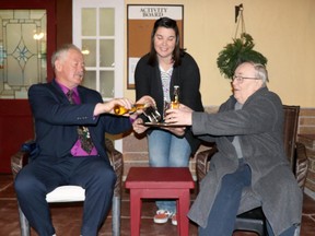 Rosemary Voight (Amanda Hicks Moss) serves beer to Jonas Ainsworth (Vernon Bailey) and her father, Barry Butterfield (Harry Houston), in a scene from Sault Theatre Workshop's production of Jonas and Barry in the Home. BRIAN KELLY