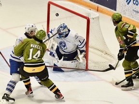 Dalyn Wakely of the North Bay Battalion roofs the puck past Mississauga Steelheads goaltender Roman Basran in a 3-2 Ontario Hockey League victory via shootout Thursday night. The Troops' Liam Arnsby monitors the action as defender Ole Bjorgvik-Holm can't tie up Wakely.
Sean Ryan Photo