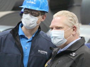 Ontario Premier Doug Ford with steeworker at Algoma Steel's direct strip production complex in Sault Ste. Marie, Ont., on Friday, April 8, 2022. (BRIAN KELLY/THE SAULT STAR/POSTMEDIA NETWORK)