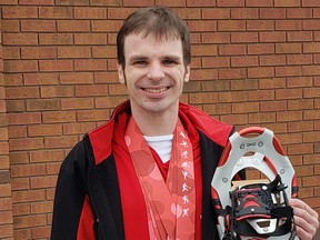 Mathieu Gervais displays his Special Olympics snowshoeing medals.