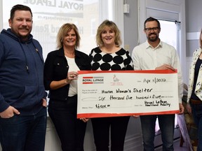 Royal LePage Heartland Realty made a $6,505 donation to the Huron Women’s Shelter at its Clinton office April 1. From left are Jeff Bauer, Huron Women’s Shelter manager of fund development Krista Evely, Shana Barnim, Rick Lobb and Amanda Zehr. Dan Rolph