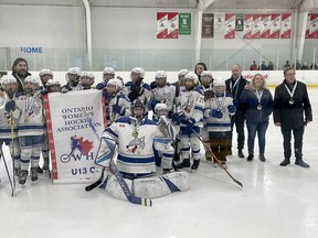 Sudbury U13 C Lady Wolves players and staff celebrate their OWHA provincial championship.