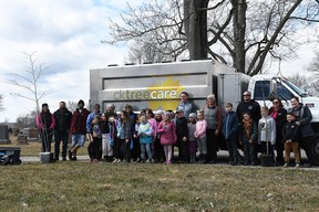 CK Tree Care brought in Dresden Area Central School students and other community volunteers on April 7, 2022 to plant new trees at the Dresden Cemetery after a storm uprooted and damaged several trees in September. (Tom Morrison/Chatham this week)