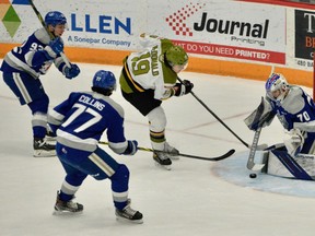 Kyle McDonald of the North Bay Battalion tests Mitchell Weeks of the Sudbury Wolves in Ontario Hockey League action Friday night as Matthew Mania and Nolan Collins come to their goaltender's aid. The Troops complete the regular season with a Sunday visit to the Oshawa Generals.
Sean Ryan Photo