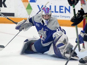 Sudbury Wolves goaltender Mitchell Weeks makes a glove save during first-period OHL action against the North Bay Battalion at Sudbury Community Arena in Sudbury, Ontario on Friday, April 15, 2022.